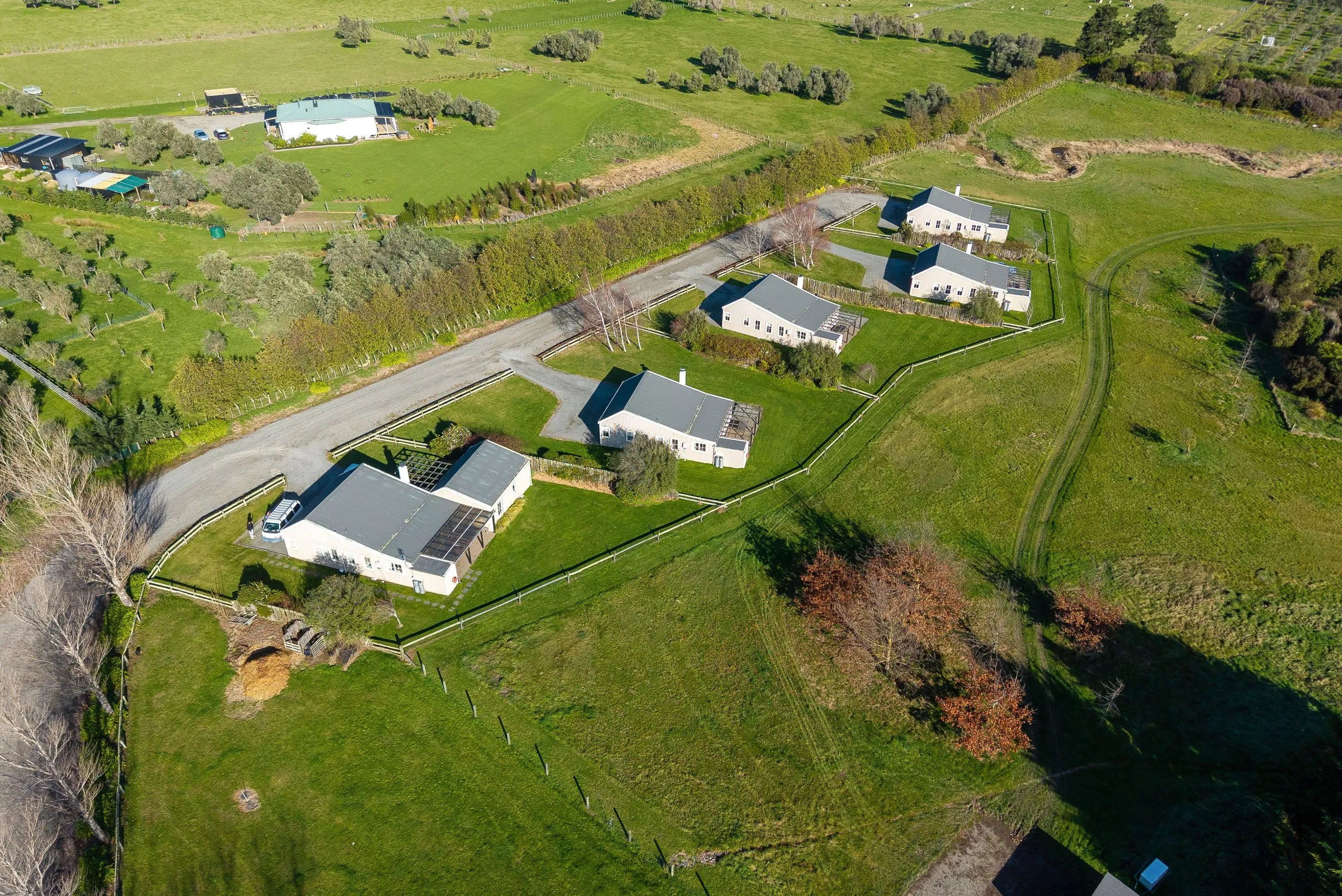 Brackenridge Estate from the air, cottages spread across open Martinborough grounds