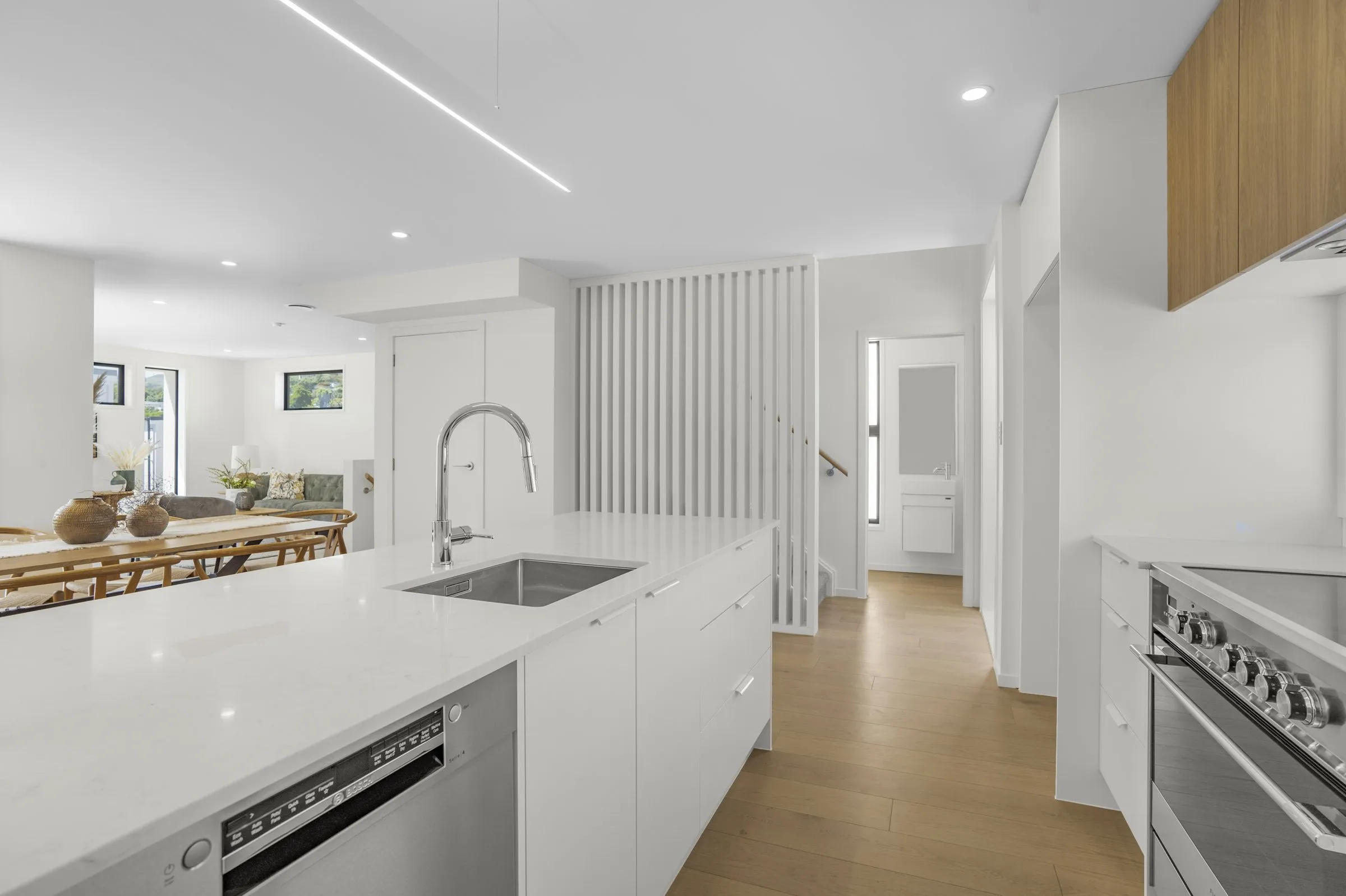 White kitchen with stone benchtop