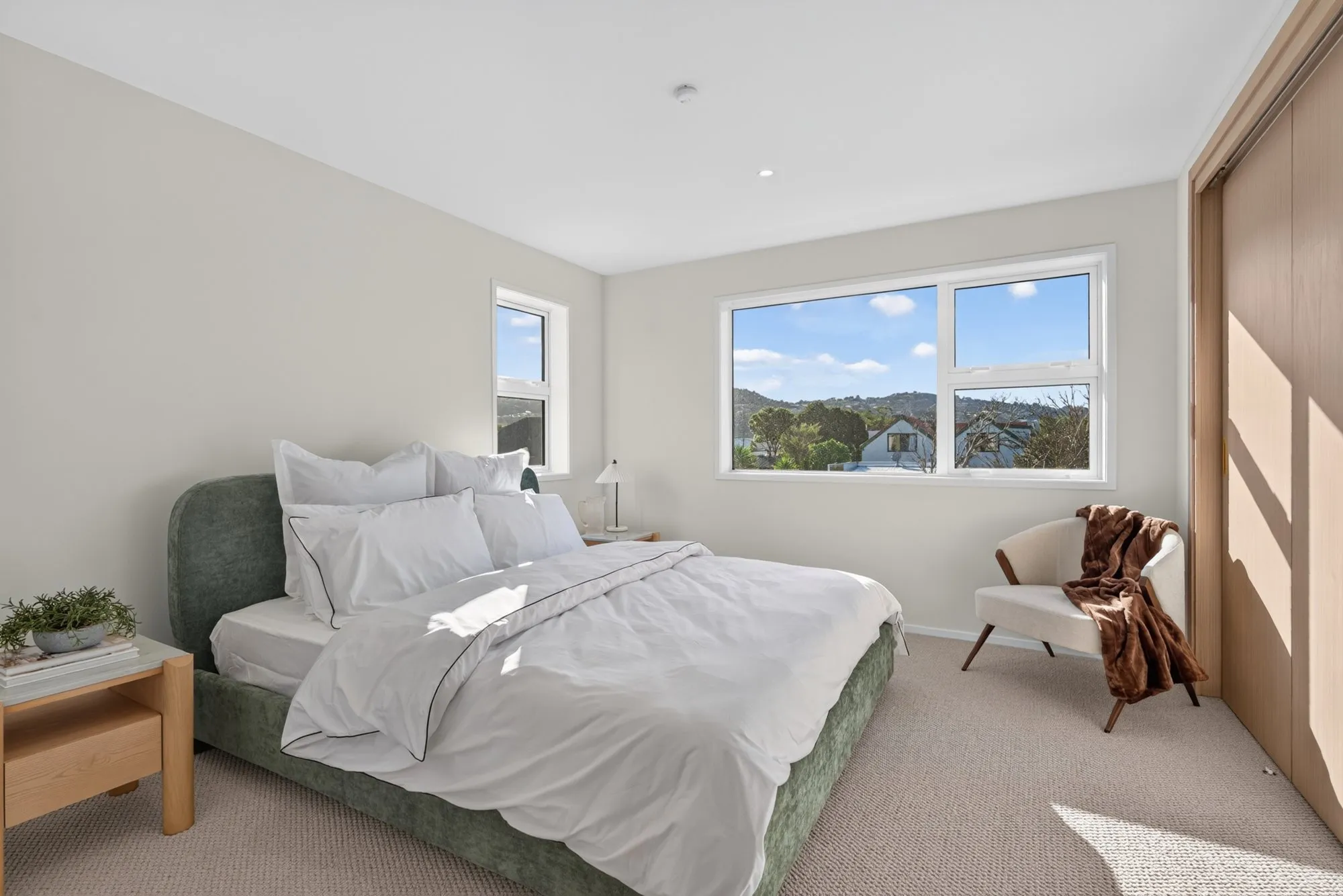 Bedroom with a view over Petone rooftops