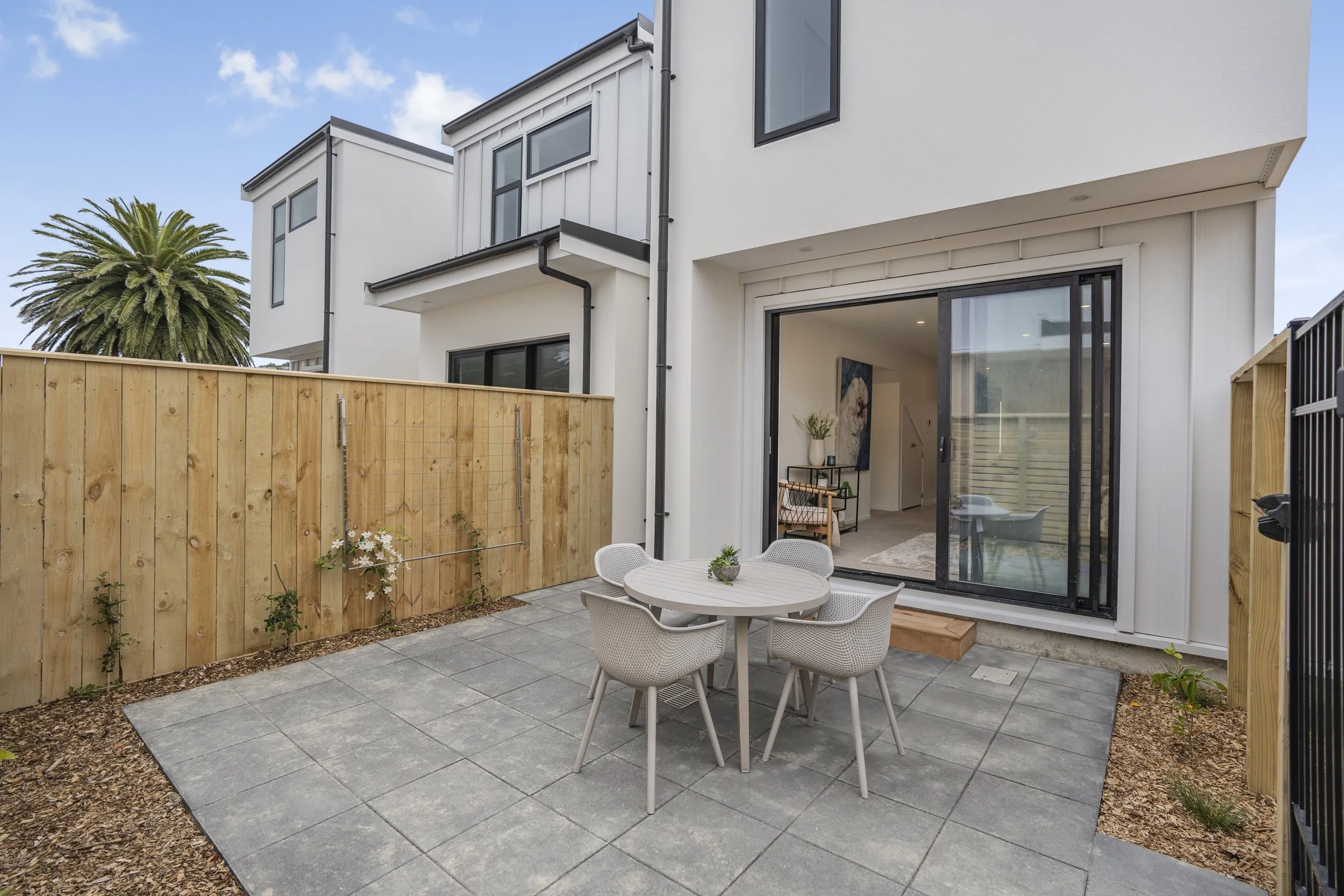 Private paved courtyard with outdoor dining