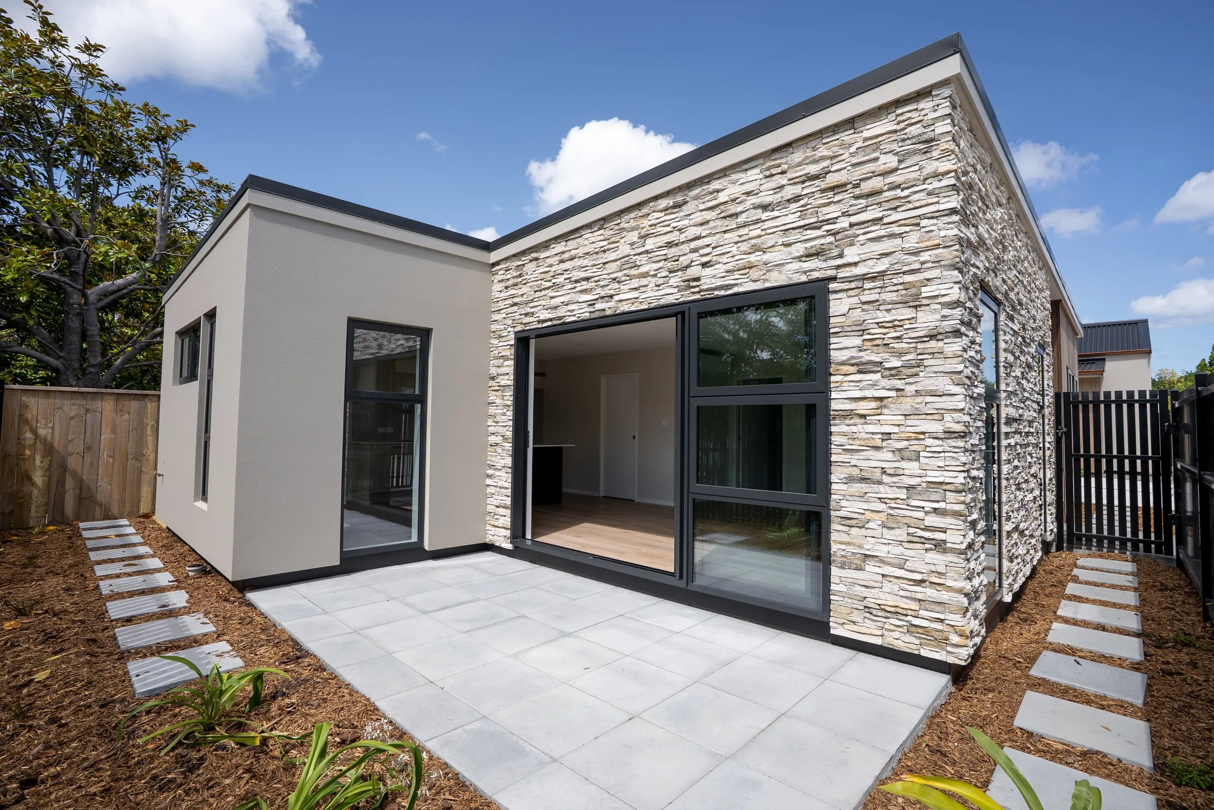 A single level villa with a stone feature wall
